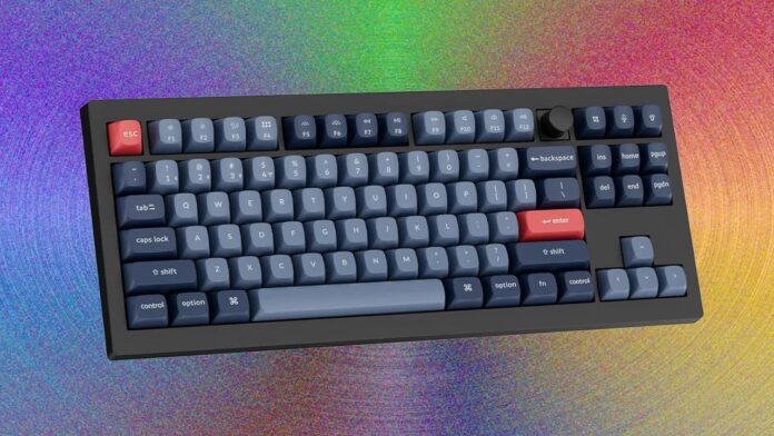 Custom mechanical keyboard with dark blue keycaps and modern color theme